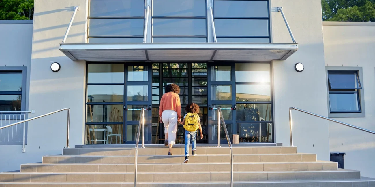 School education and mother walking with child