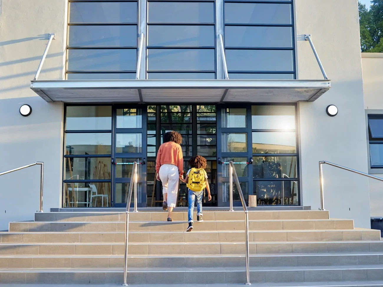 School education and mother walking with child