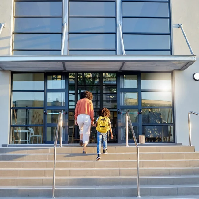 School education and mother walking with child